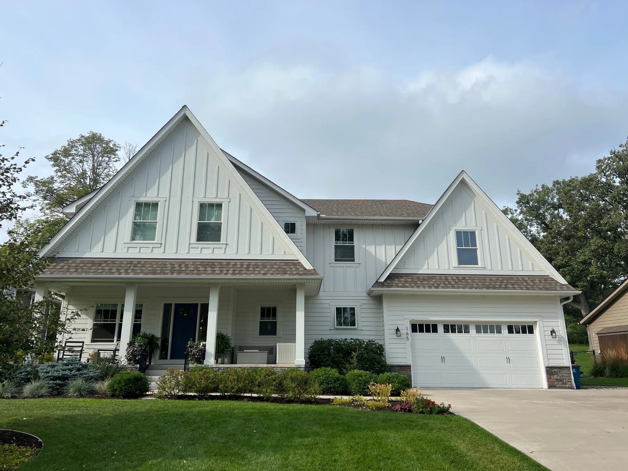 White home with a finished roof and siding